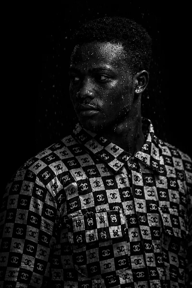 Black-and-white portrait of Eze Prince in a patterned shirt